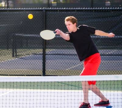 Playing pickleball young men