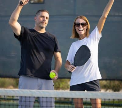 pickleball couple player happy face