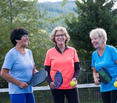 old womens are playing pickleball